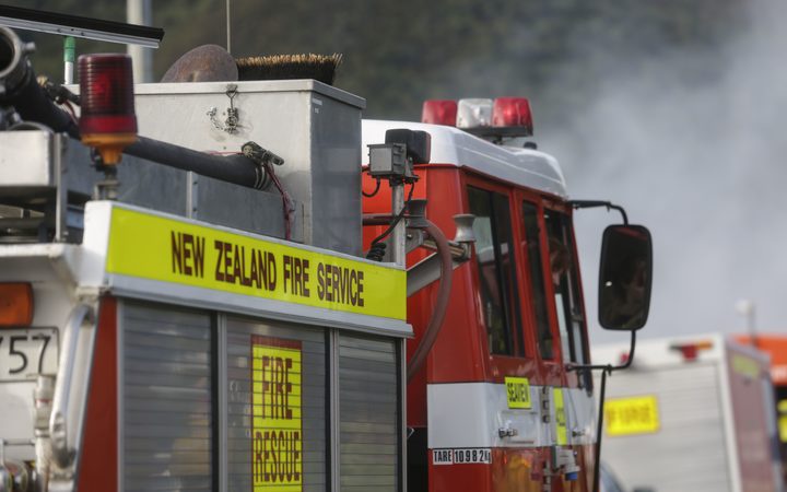 a fire truck, with
smoke visible behind it